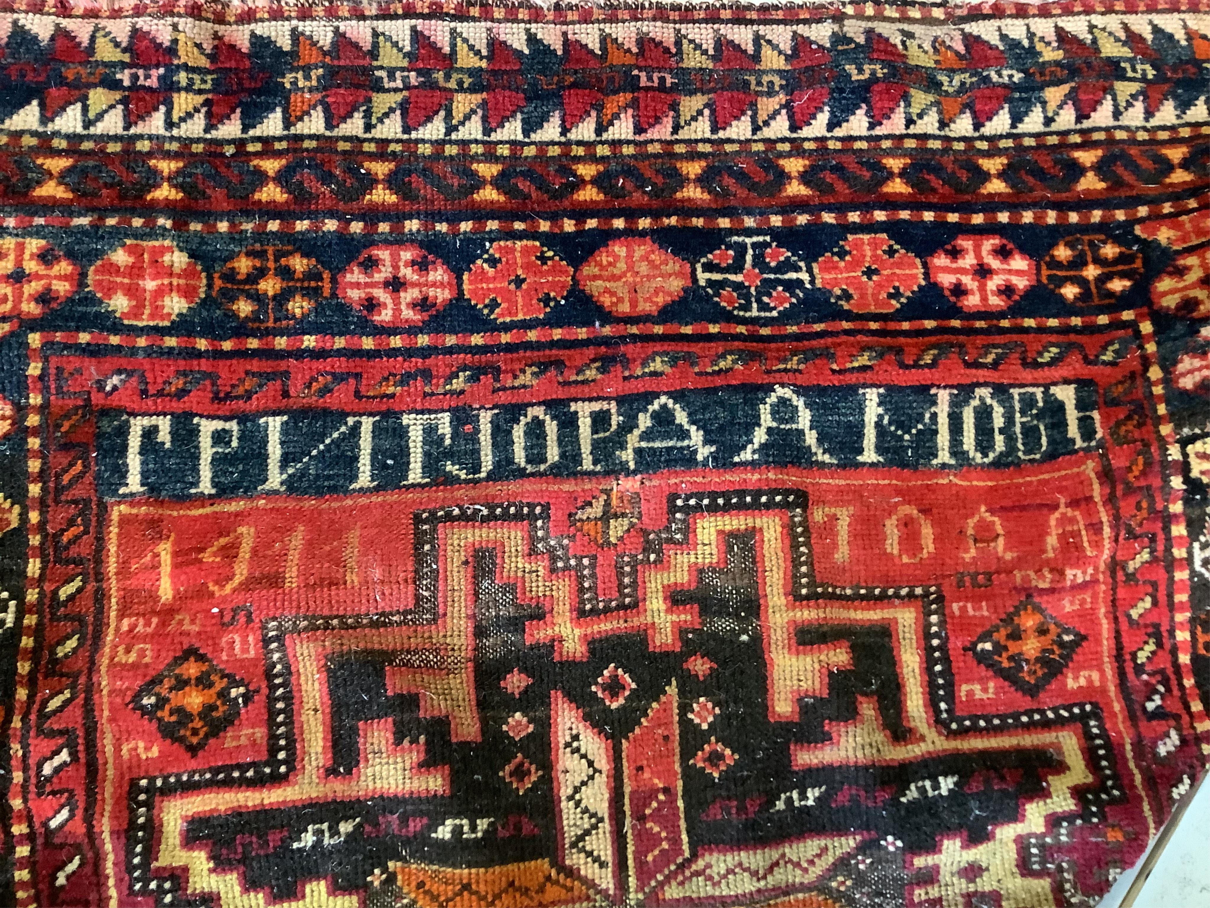 A Caucasian red ground rug, 250 x 130cm. Condition - fair